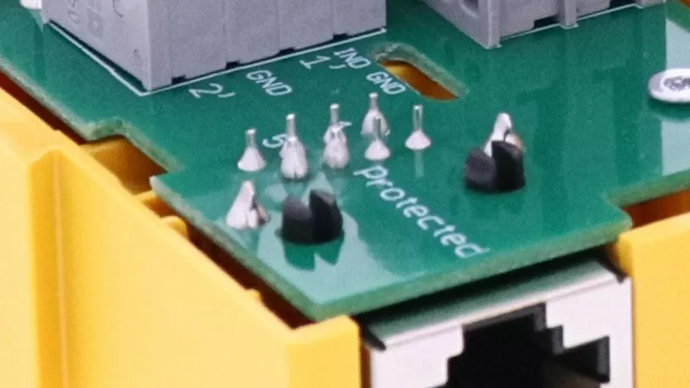 Close-up of terminal blocks and an RJ45 port on a DEHNbox circuit board.